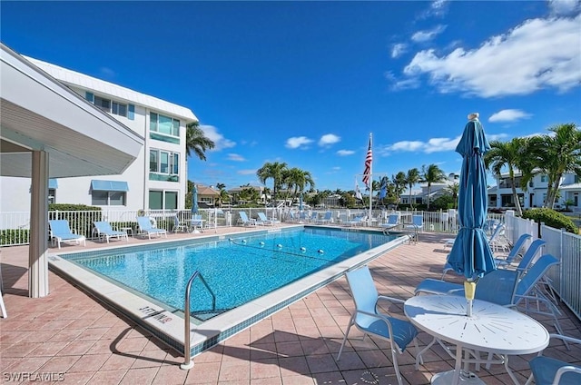 view of swimming pool with a patio area