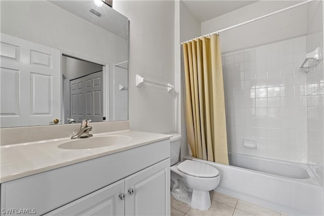 full bathroom featuring vanity, tile patterned floors, toilet, and shower / bath combo with shower curtain