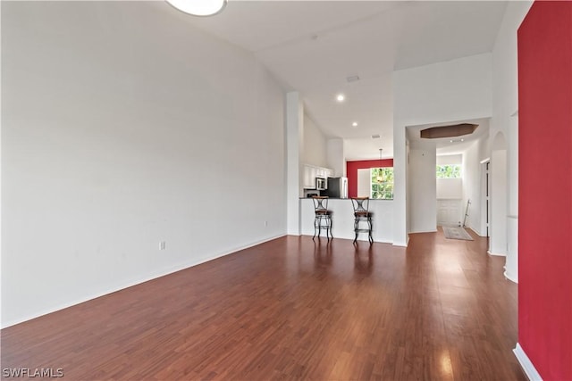 empty room featuring dark hardwood / wood-style flooring