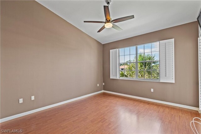 empty room featuring hardwood / wood-style flooring and ceiling fan