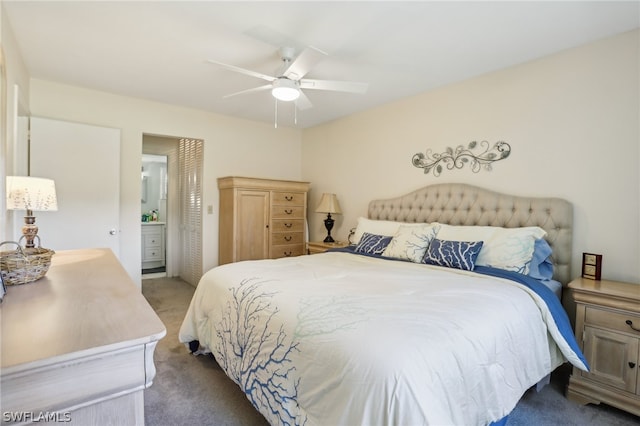 bedroom featuring ceiling fan, light carpet, and connected bathroom