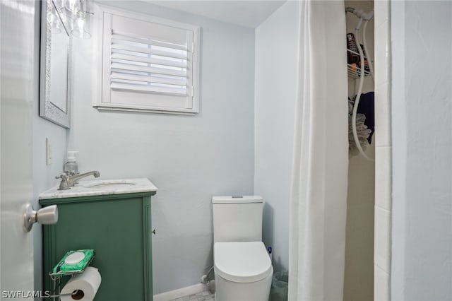 bathroom with toilet and vanity