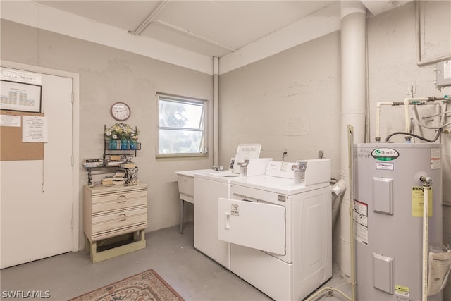 clothes washing area with water heater and washing machine and clothes dryer