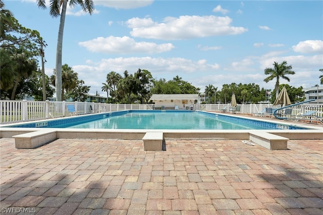 view of swimming pool featuring a patio