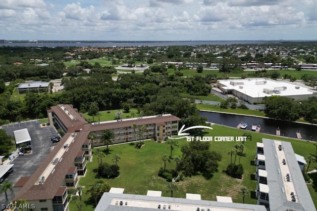 birds eye view of property with a water view