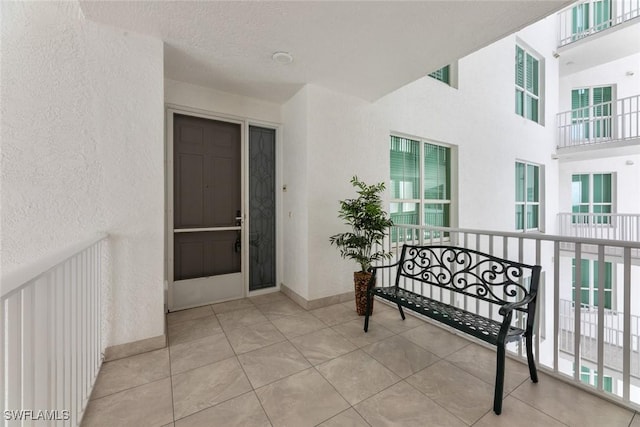 entrance to property featuring stucco siding