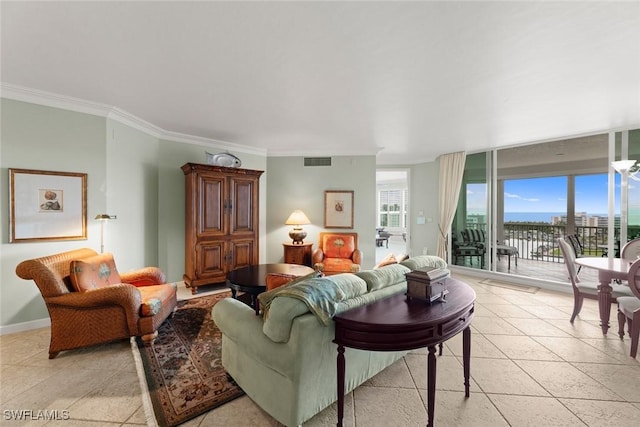 living room with crown molding, baseboards, a water view, and light tile patterned floors