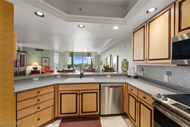 kitchen with light tile patterned floors, tasteful backsplash, stainless steel appliances, ornamental molding, and kitchen peninsula