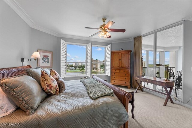 carpeted bedroom featuring ornamental molding, access to exterior, and a ceiling fan