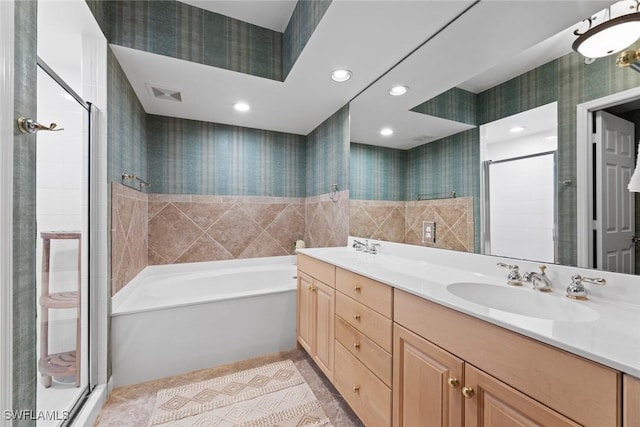 full bathroom with wallpapered walls, a stall shower, a bath, tile patterned floors, and double vanity