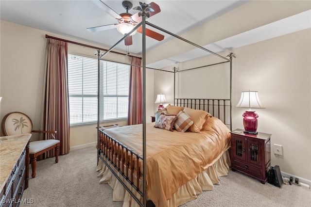 bedroom featuring light carpet, baseboards, and a ceiling fan