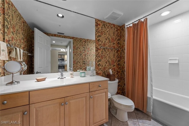 bathroom with wallpapered walls, toilet, vanity, recessed lighting, and shower / tub combo