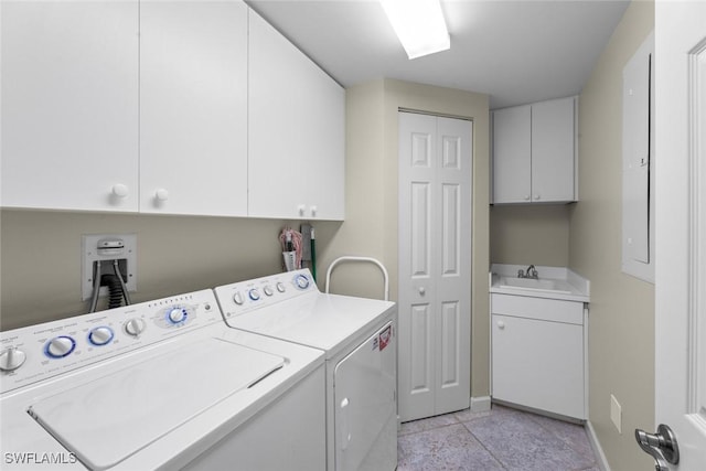 laundry area with cabinet space, washing machine and clothes dryer, and baseboards
