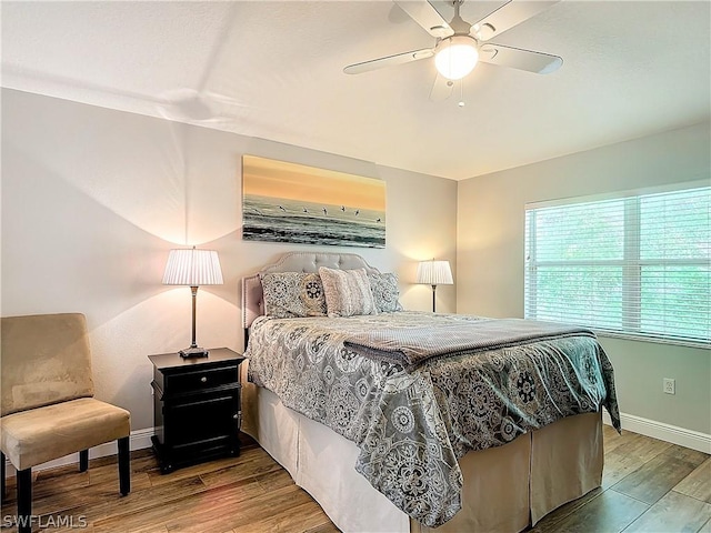 bedroom featuring hardwood / wood-style flooring and ceiling fan