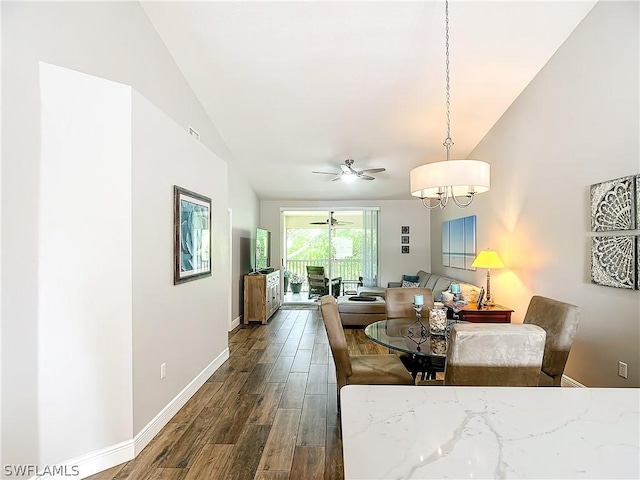 dining area featuring ceiling fan with notable chandelier