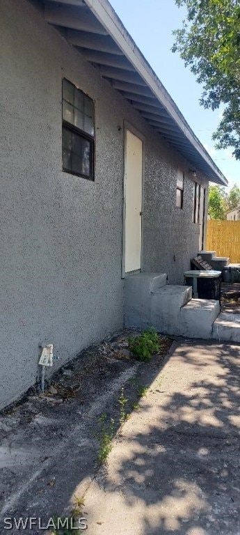 view of side of home featuring a patio area