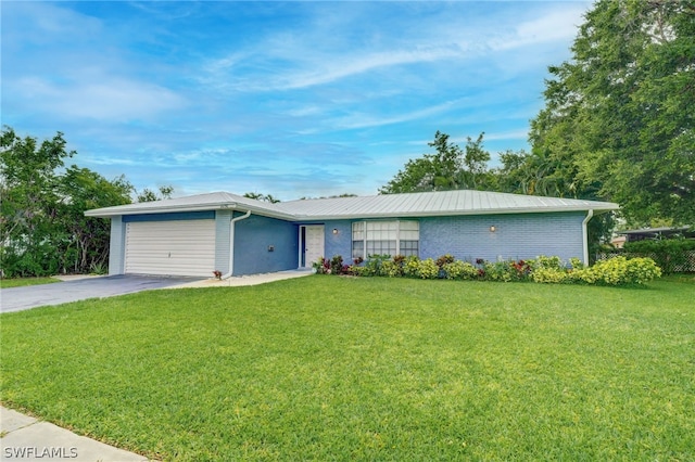 ranch-style home with a garage and a front yard