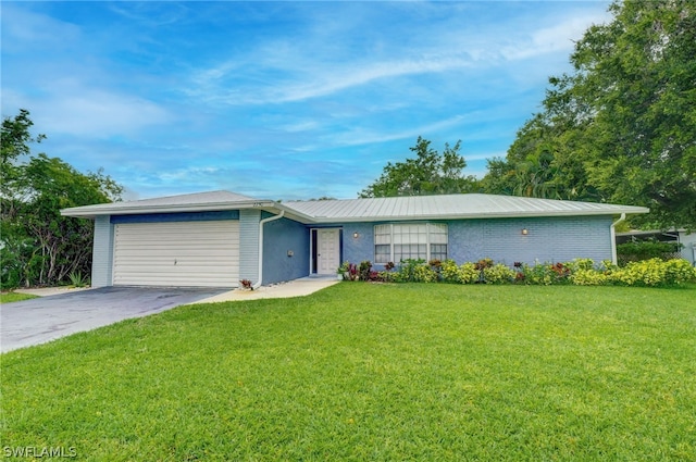 single story home with a front yard and a garage