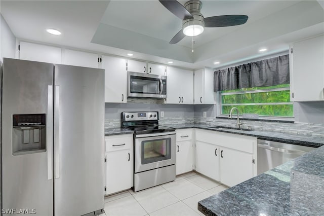 kitchen with sink, white cabinets, and appliances with stainless steel finishes