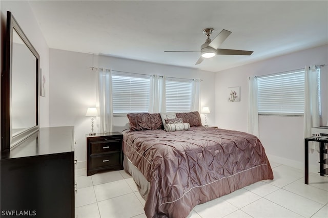 bedroom featuring ceiling fan and light tile patterned floors