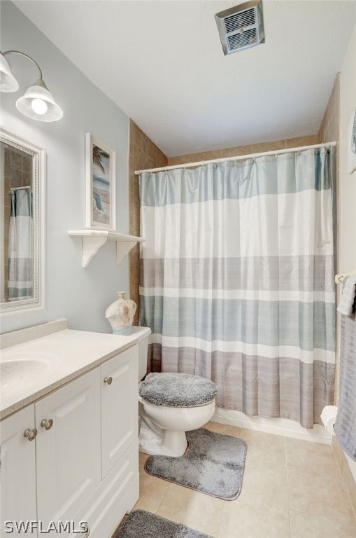 bathroom featuring tile patterned flooring, vanity, toilet, and a shower with shower curtain