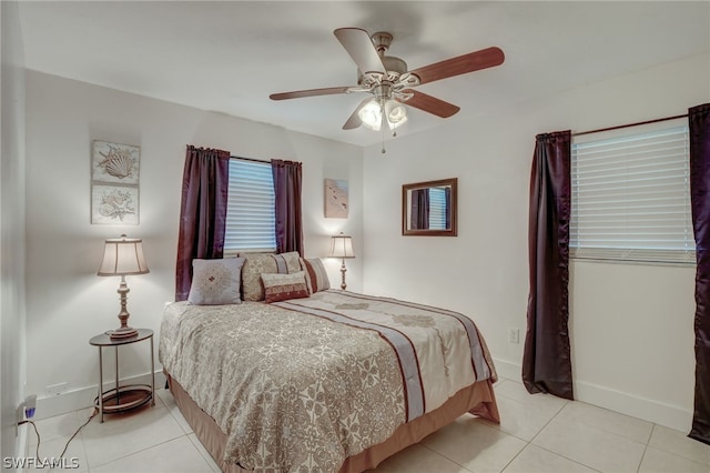 tiled bedroom with ceiling fan