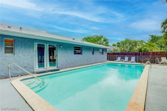 view of swimming pool with a patio area