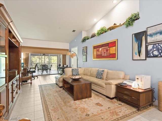 tiled living room with high vaulted ceiling