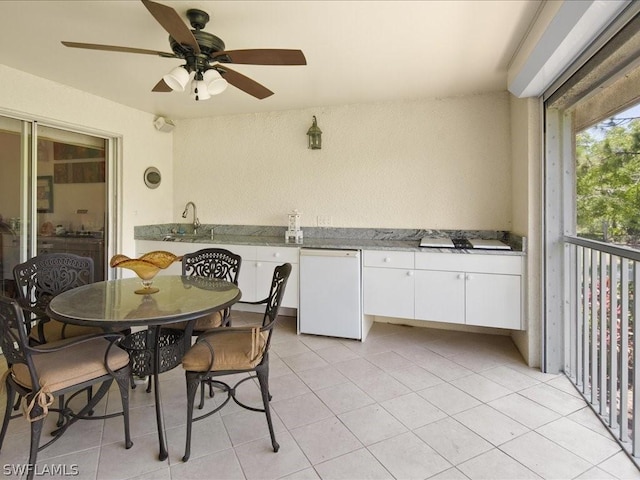 dining room with sink and light tile patterned floors