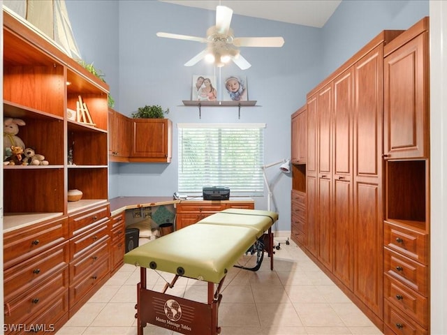 tiled office featuring built in desk, high vaulted ceiling, and ceiling fan