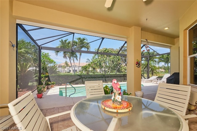 sunroom featuring a pool