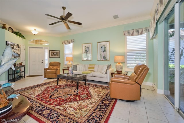 living room with ceiling fan, light tile patterned flooring, and crown molding