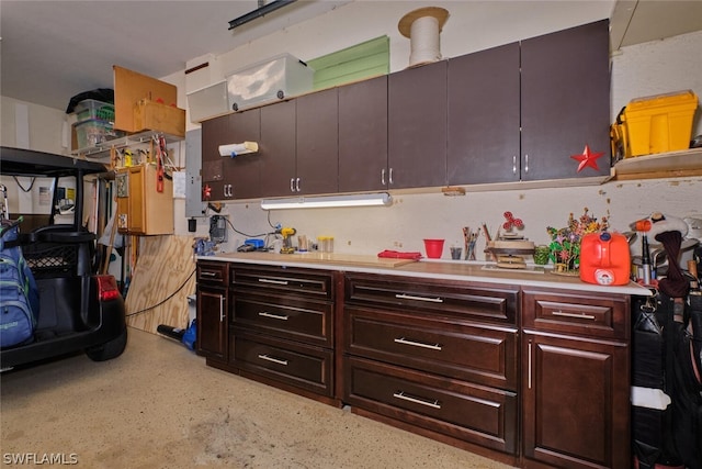 kitchen featuring dark brown cabinets