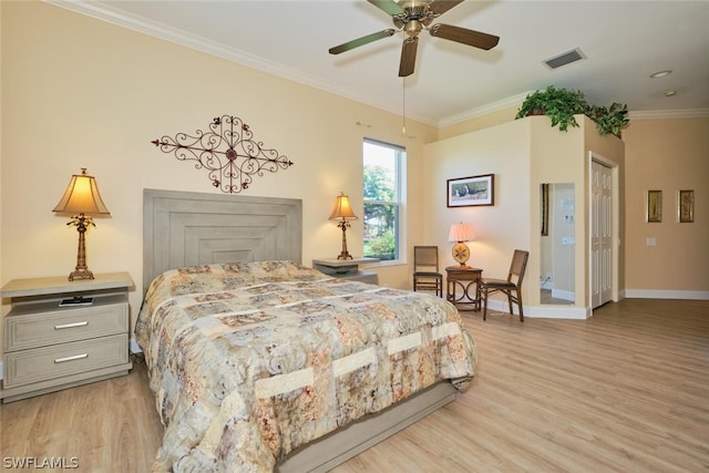 bedroom with light wood-type flooring, ceiling fan, and ornamental molding