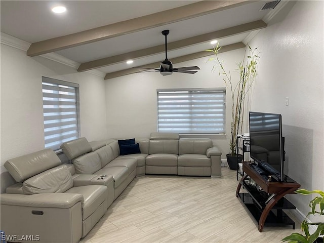 living room with ceiling fan, lofted ceiling with beams, and plenty of natural light