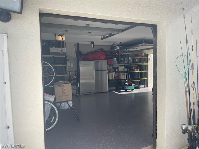 garage featuring stainless steel refrigerator