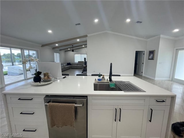 kitchen with lofted ceiling, dishwasher, sink, ornamental molding, and white cabinets