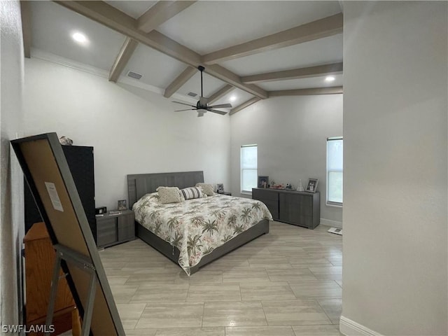 bedroom with ceiling fan and lofted ceiling with beams