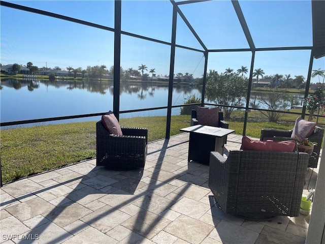 view of patio with a water view, an outdoor hangout area, and a lanai