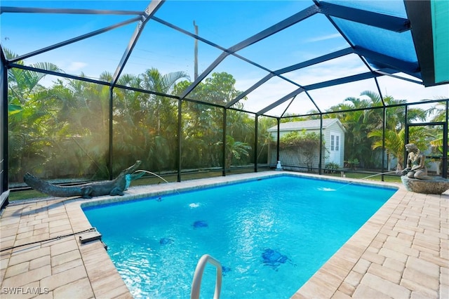 view of swimming pool with pool water feature, a lanai, an outdoor structure, and a patio area