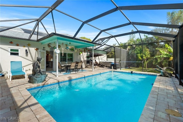 view of swimming pool featuring a lanai, a patio, and pool water feature