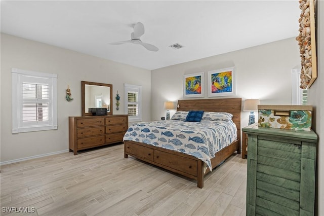 bedroom featuring light wood-type flooring and ceiling fan