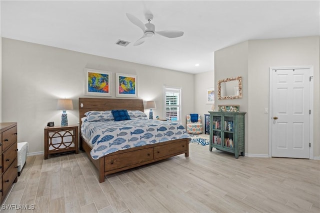 bedroom with ceiling fan and light hardwood / wood-style flooring