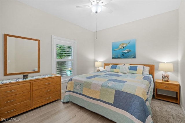 bedroom featuring light wood-type flooring and ceiling fan