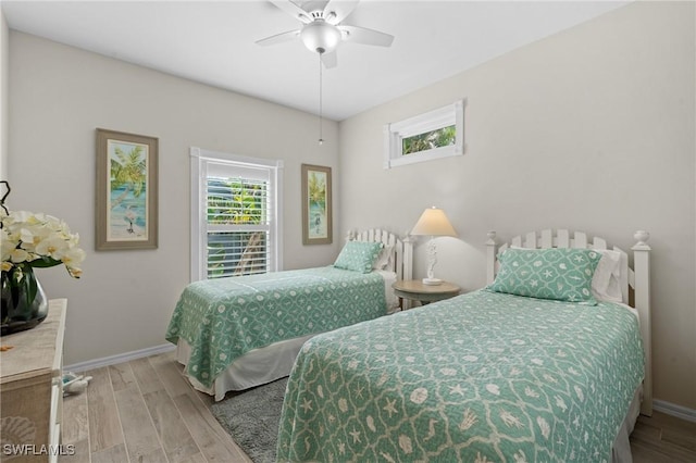 bedroom featuring ceiling fan and light hardwood / wood-style floors