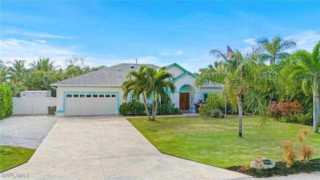 view of front of home featuring a front lawn and a garage