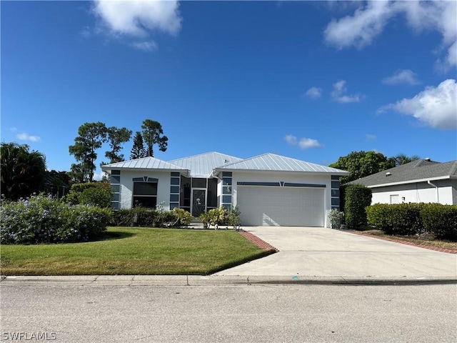 view of front of home featuring a front yard and a garage