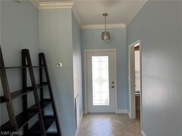 foyer with light tile patterned floors and ornamental molding