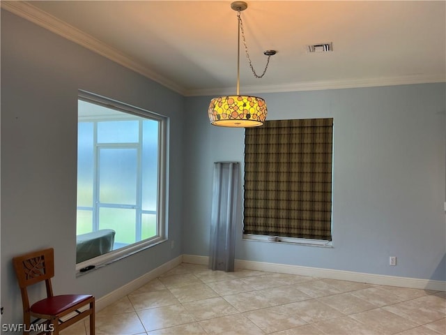 unfurnished room featuring crown molding and light tile patterned floors