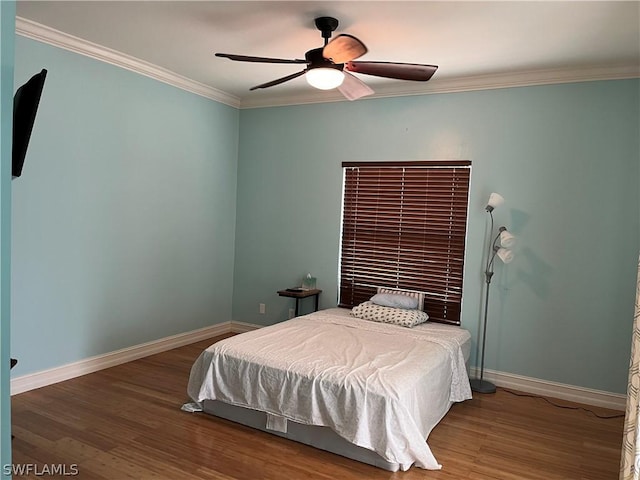 bedroom with ceiling fan, hardwood / wood-style flooring, and ornamental molding